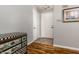 Welcoming entryway features wood flooring and a decorative chest of drawers at 9520 Settlement W Dr, Indianapolis, IN 46250