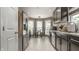 Modern kitchen with stainless steel appliances, sleek cabinets, and eat-in breakfast nook at 9520 Settlement W Dr, Indianapolis, IN 46250