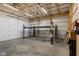 Large garage with a vehicle lift, bright lighting, and ample space for storage at 953 E 34Th St, Indianapolis, IN 46205