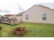 Backyard featuring a wooden deck, fenced yard and mature trees offering private relaxation and entertainment space at 982 Ramsgate Rd, Greenwood, IN 46143