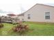 Spacious backyard with patio perfect for entertaining, surrounded by a well-maintained lawn and garden at 982 Ramsgate Rd, Greenwood, IN 46143