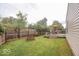 Spacious backyard featuring a wooden deck with outdoor seating and a well-maintained lawn at 982 Ramsgate Rd, Greenwood, IN 46143