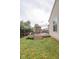 A wooden deck with an umbrella and furniture in a backyard with green grass and a wooden fence at 982 Ramsgate Rd, Greenwood, IN 46143