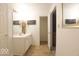 Bright bathroom featuring a vanity, large mirror, and decorative wall art at 982 Ramsgate Rd, Greenwood, IN 46143
