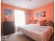 Comfortable bedroom with large windows and beach-themed art on the walls at 982 Ramsgate Rd, Greenwood, IN 46143