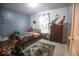 Bright bedroom featuring dinosaur themed decor and a large window at 982 Ramsgate Rd, Greenwood, IN 46143