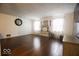 Spacious living room features hardwood floors, neutral walls, and large windows letting in ample natural light at 982 Ramsgate Rd, Greenwood, IN 46143