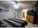 Spacious main bedroom with a ceiling fan, television, and ample closet space at 982 Ramsgate Rd, Greenwood, IN 46143
