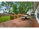 Enjoy outdoor dining on this wood deck overlooking a lush, green backyard at 99 Old Trail Dr, Bargersville, IN 46106