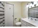 A clean bathroom features a white vanity, toilet, and a shower with a decorative curtain at 99 Old Trail Dr, Bargersville, IN 46106