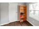 Bedroom with a bookshelf and a window view, enhanced by modern hardwood flooring at 99 Old Trail Dr, Bargersville, IN 46106