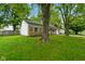 Charming single-story brick home with a well-manicured lawn and mature shade trees at 99 Old Trail Dr, Bargersville, IN 46106