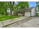 Inviting brick home features a one-car garage and a cozy front porch with rocking chairs at 99 Old Trail Dr, Bargersville, IN 46106