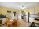 Sun-lit kitchen with breakfast nook, stainless refrigerator, and tile flooring at 99 Old Trail Dr, Bargersville, IN 46106