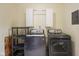 The laundry room has modern washer and dryer with overhead cabinets and a utility shelf at 99 Old Trail Dr, Bargersville, IN 46106