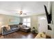 Cozy living room with comfortable seating, a ceiling fan, and natural light at 99 Old Trail Dr, Bargersville, IN 46106