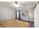 This bedroom features a ceiling fan, hardwood floors, television and natural light from the window at 99 Old Trail Dr, Bargersville, IN 46106