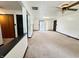 Open basement with light carpet and access to outside at 100 Justin Dr, Mooresville, IN 46158