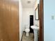 Compact half bathroom with pedestal sink, tile flooring, and essential fixtures at 100 Justin Dr, Mooresville, IN 46158