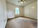 Bedroom featuring neutral walls, carpeting, a ceiling fan, and natural light at 100 Justin Dr, Mooresville, IN 46158