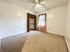 This bedroom features neutral carpeting, a ceiling fan, natural light, and a closet at 100 Justin Dr, Mooresville, IN 46158