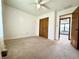 Bright bedroom featuring neutral carpet, white walls and a ceiling fan at 100 Justin Dr, Mooresville, IN 46158