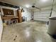 Spacious garage features a workbench, storage cabinets, and ample room for vehicles and projects at 100 Justin Dr, Mooresville, IN 46158