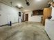 Large garage offers generous storage, a service door, and access to the home's interior at 100 Justin Dr, Mooresville, IN 46158