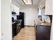 Efficient kitchen featuring dark appliances and lighter cabinets at 100 Justin Dr, Mooresville, IN 46158