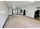 Spacious living room with neutral carpet and an open layout at 100 Justin Dr, Mooresville, IN 46158