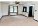 Bright, open living room with large window and neutral carpeting at 100 Justin Dr, Mooresville, IN 46158