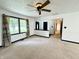 Bright living room with large windows, neutral carpeting, and an open layout for flexible living at 100 Justin Dr, Mooresville, IN 46158