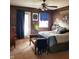 Cozy bedroom features a ceiling fan, natural light, and neutral colored walls at 1027 Springway Dr, Shelbyville, IN 46176