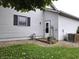 Exterior shot of the side of the home with a backdoor and an HVAC unit at 1027 Springway Dr, Shelbyville, IN 46176
