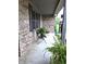 Inviting covered front porch with comfortable seating and views of the landscaped front yard at 1027 Springway Dr, Shelbyville, IN 46176