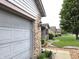 Close up of a well maintained garage in a quiet neighborhood with manicured lawns at 1027 Springway Dr, Shelbyville, IN 46176