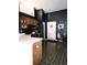 Cozy kitchen with wooden cabinets, updated appliances, and checkered tile floors at 1027 Springway Dr, Shelbyville, IN 46176