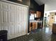 View of kitchen featuring tile floors, wooden cabinetry, closet, and natural light at 1027 Springway Dr, Shelbyville, IN 46176