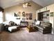 Comfortable living room with a ceiling fan, neutral carpet, and bright natural light at 1027 Springway Dr, Shelbyville, IN 46176
