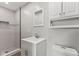 Modern bathroom featuring tiled shower with mosaic accents, stylish vanity, updated mirror, and toilet at 10727 N Shupe Rd, Monrovia, IN 46157