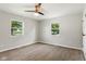 Bedroom with hardwood floors and two windows provides great views of the surrounding landscape at 10727 N Shupe Rd, Monrovia, IN 46157