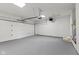 Clean and spacious garage with a white door, painted floor, and ample room for parking and storage at 10727 N Shupe Rd, Monrovia, IN 46157