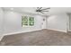 Bright living room featuring hardwood floors, a ceiling fan, a window with a view, and white trim at 10727 N Shupe Rd, Monrovia, IN 46157