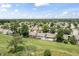 Birds eye view of residential community with golf course and mature trees at 10753 Seaview Ln, Indianapolis, IN 46236