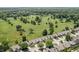 An aerial view showcases the lush golf course nestled among the residences at 10753 Seaview Ln, Indianapolis, IN 46236