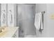 Bathroom featuring a glass shower door, towel racks, and neutral color palette at 10753 Seaview Ln, Indianapolis, IN 46236