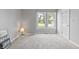 Bright bedroom featuring gray walls, neutral carpet, and two windows at 10753 Seaview Ln, Indianapolis, IN 46236
