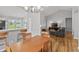 Open-concept view of dining room with bar and view to the living room at 10753 Seaview Ln, Indianapolis, IN 46236
