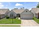 Charming single-Gathering home with a well-manicured lawn and attached two-car garage at 10753 Seaview Ln, Indianapolis, IN 46236