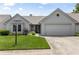 Charming single-Gathering home with a well-manicured lawn and attached two-car garage at 10753 Seaview Ln, Indianapolis, IN 46236